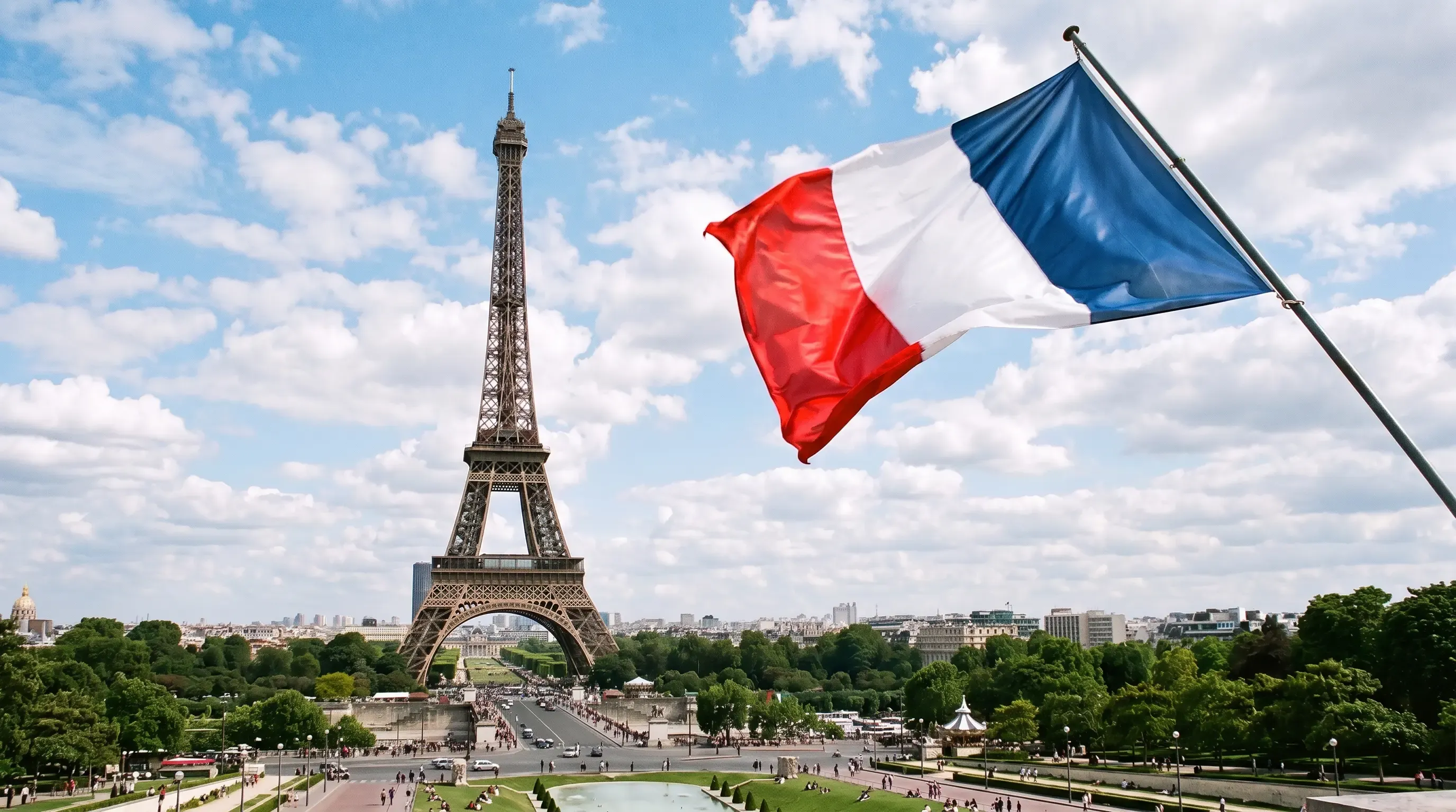 An image of the French flag waving in the sky
