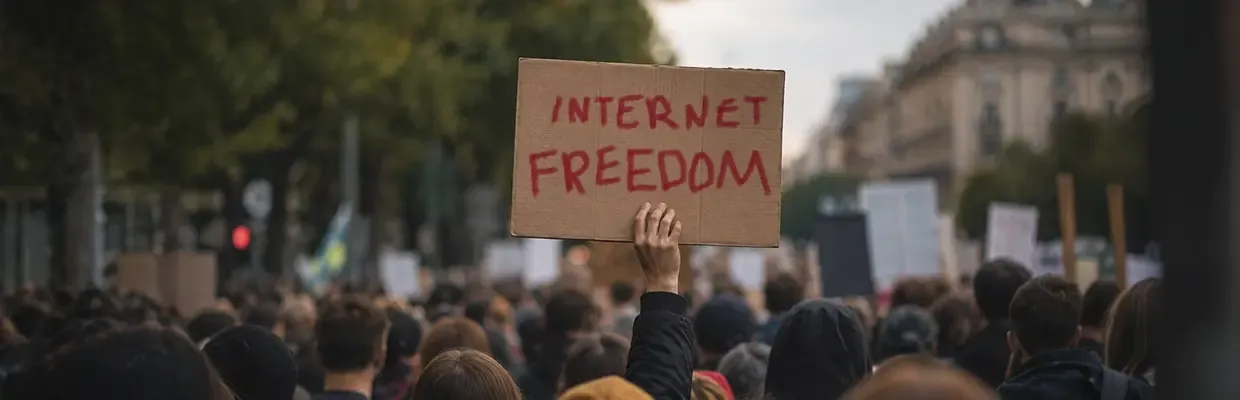 An image of a protester holding up a sign demanding internet freedom