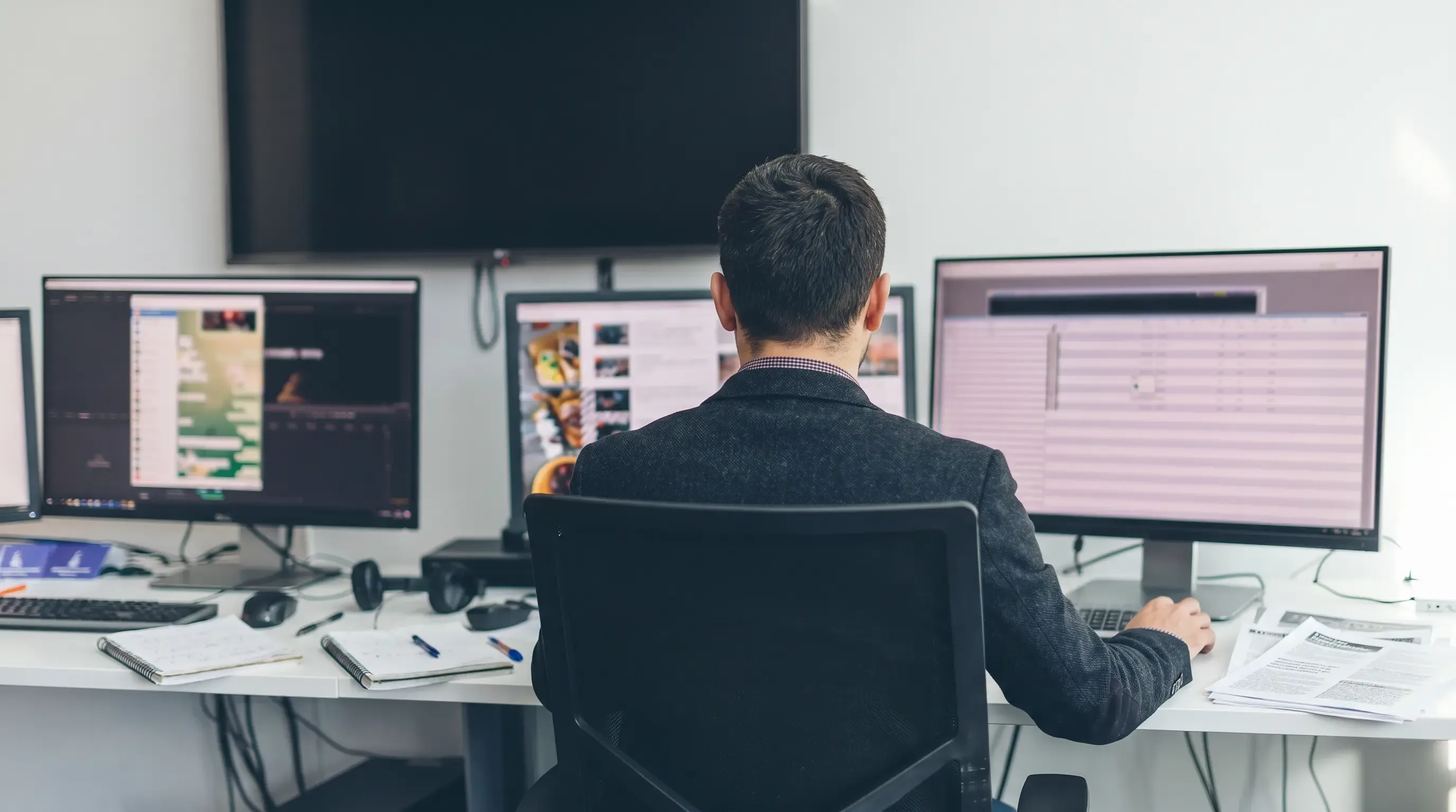 An image of a journalist working at his office desk