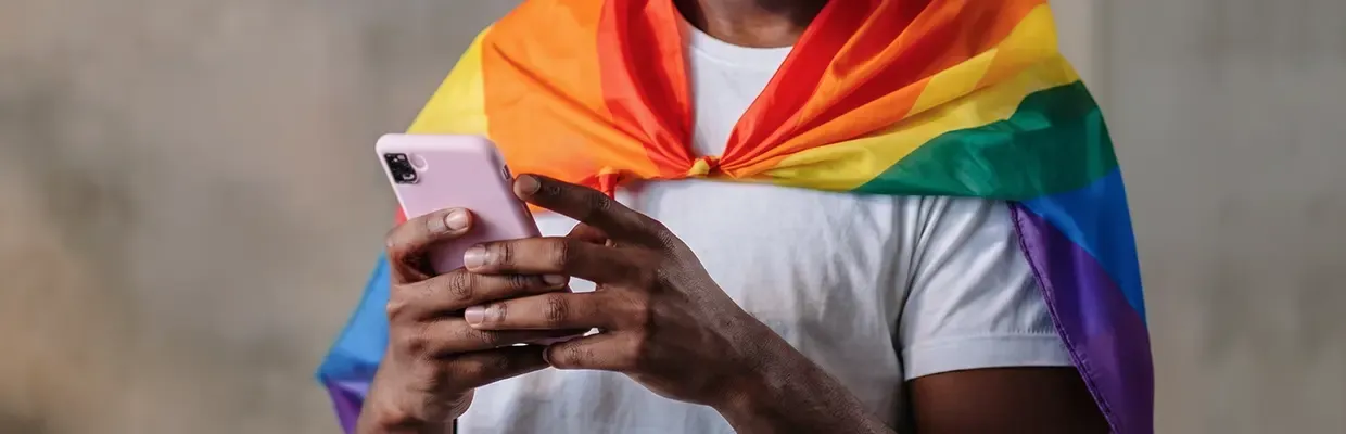 A closeup image of a man using a phone