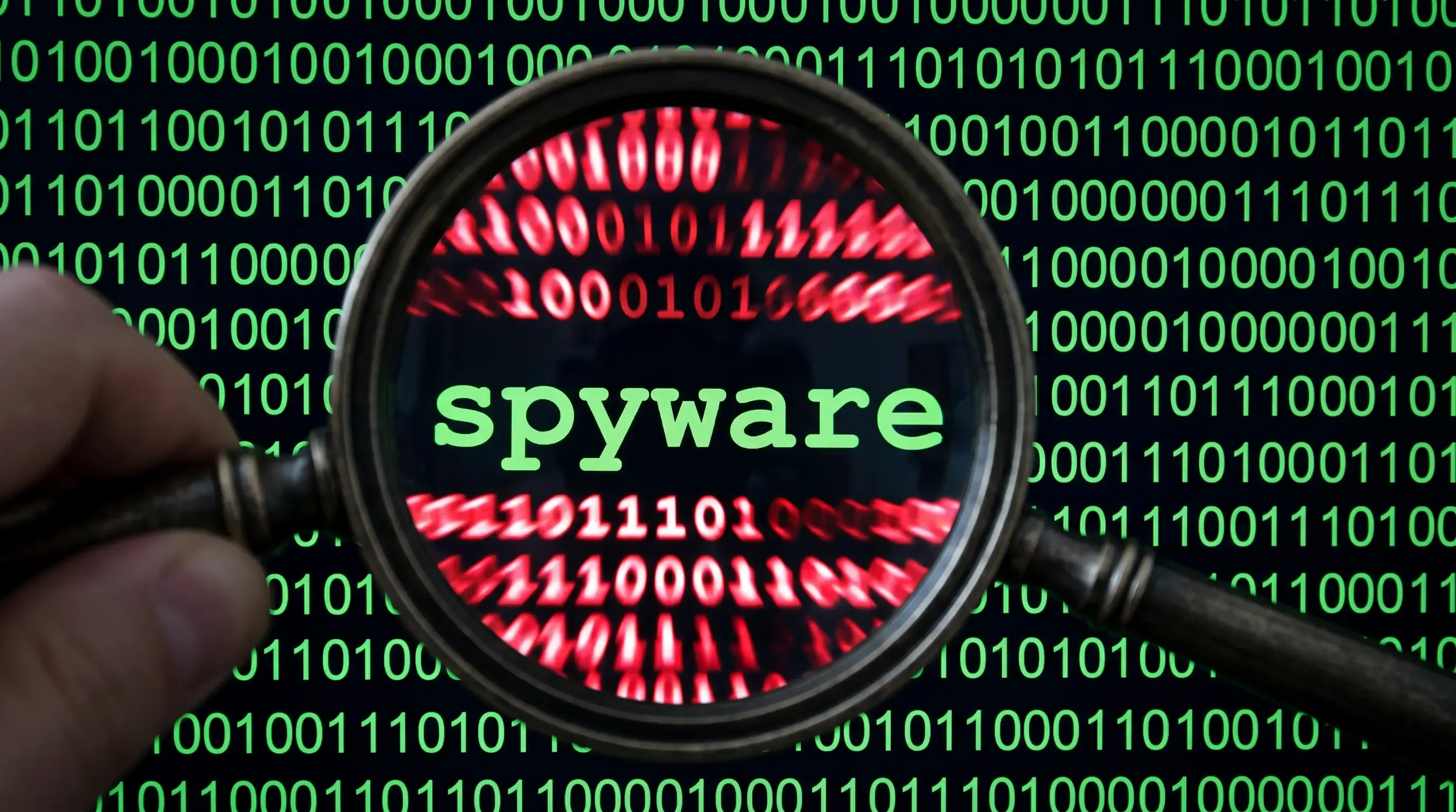 An image of the binary code with the with word "spyware" in the middle